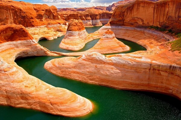 The river skirting the orange canyons