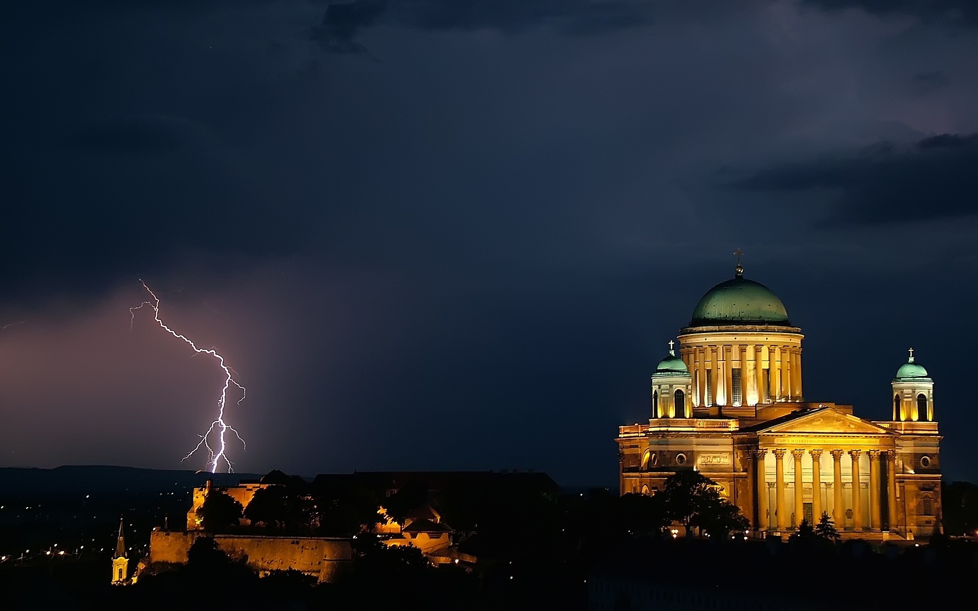 other city architecture sunset sky travel evening dusk city dawn religion outdoors lightning dome storm church temple light cathedral thunder