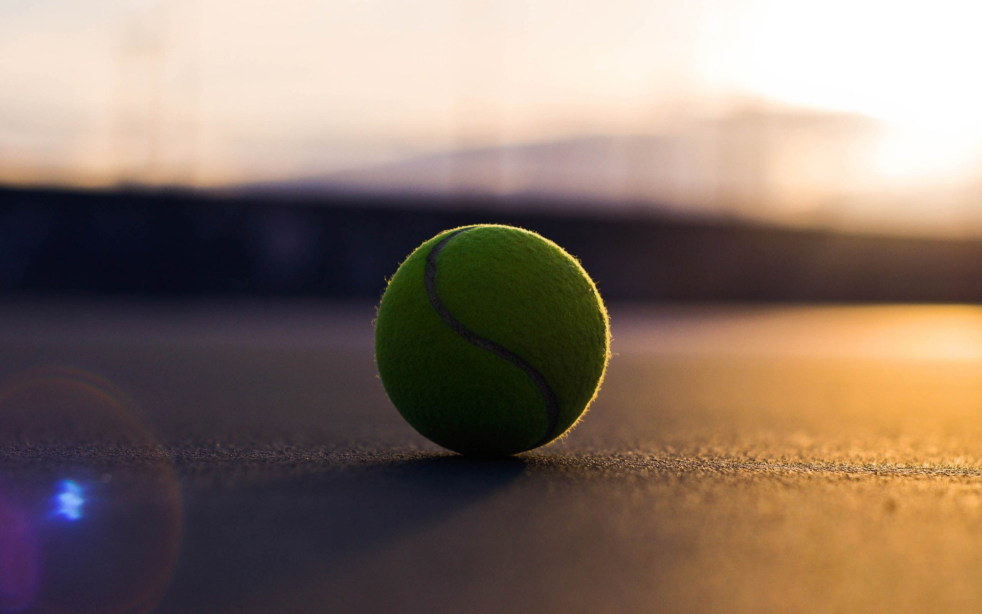 sports tennis ball blur still life competition recreation racket sunset dof sport moon sun sports equipment game leisure evening sky sphere action court green