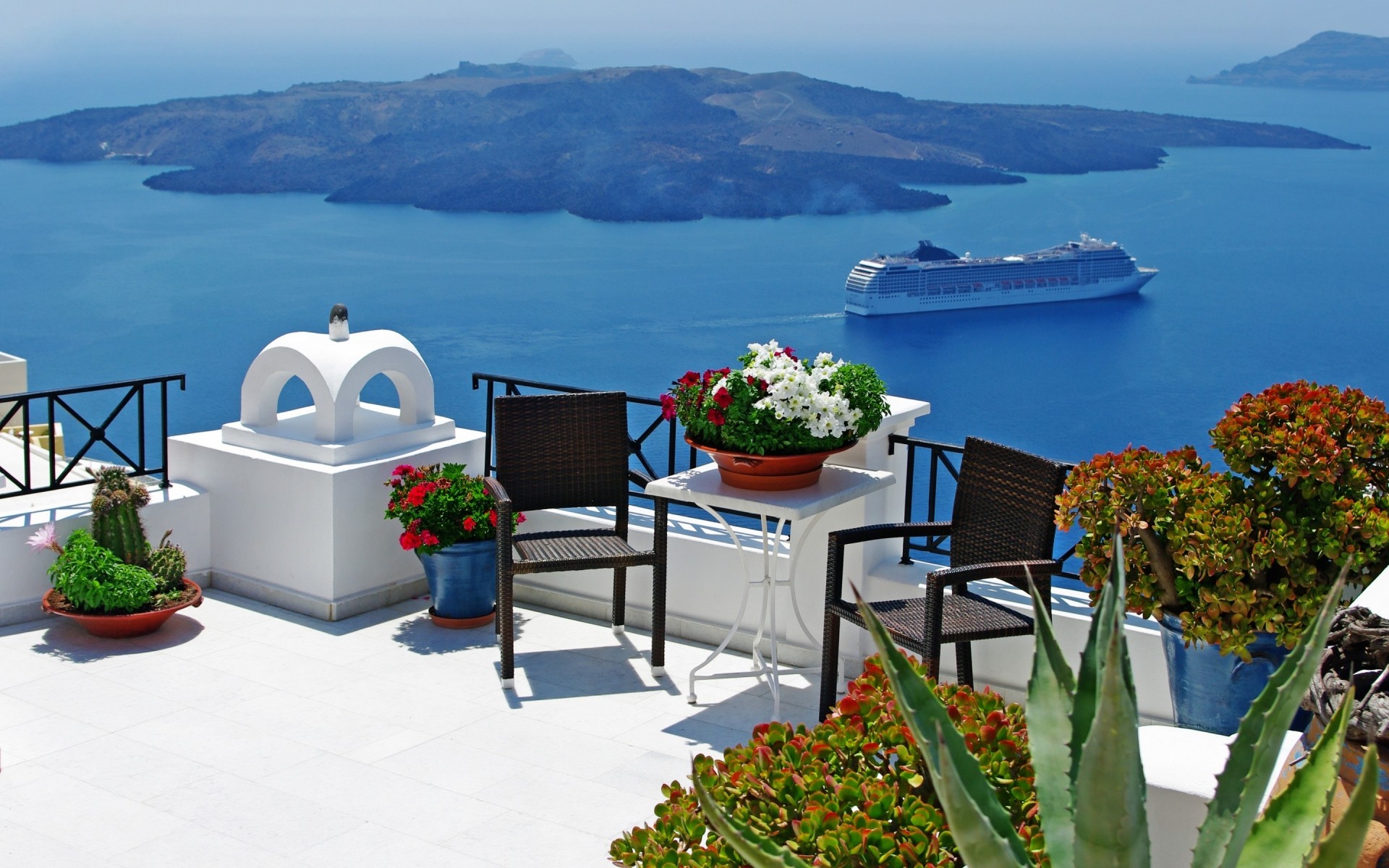 greece travel seashore water island sea chair resort hotel ocean outdoors summer beach architecture sky vacation santorini pics santorini photos santorini landscape