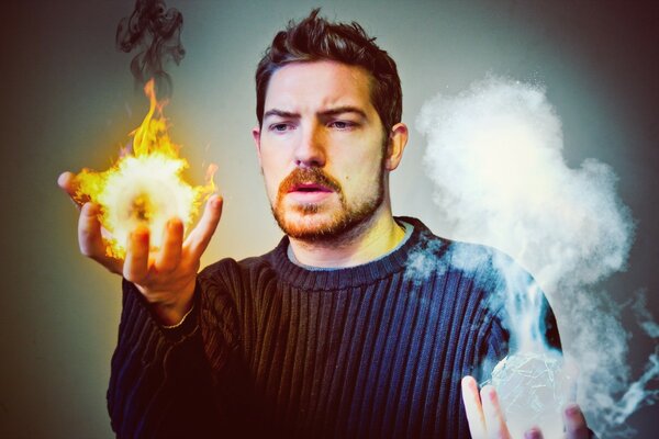 Man has the elements of fire and water in his hands