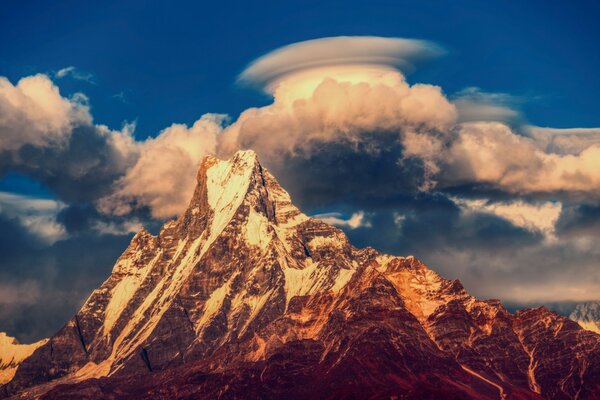 Puff cloud caught on the mountain