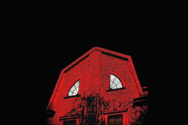 Architectural red house on a dark background