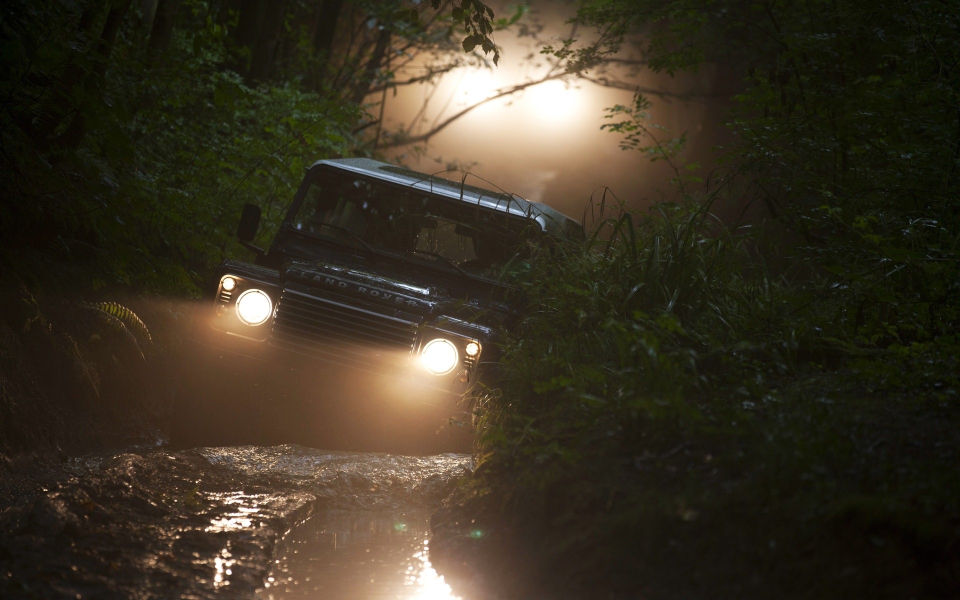 cars vehicle landscape light transportation system car road competition travel weather water race tree environment rain motion championship sunset dawn land rover defender