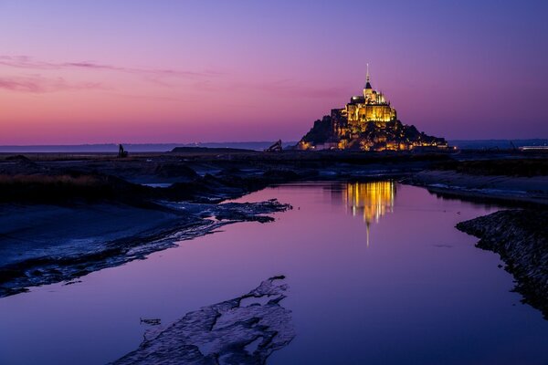 Castle on the mountain, pink-purple sky, twilight