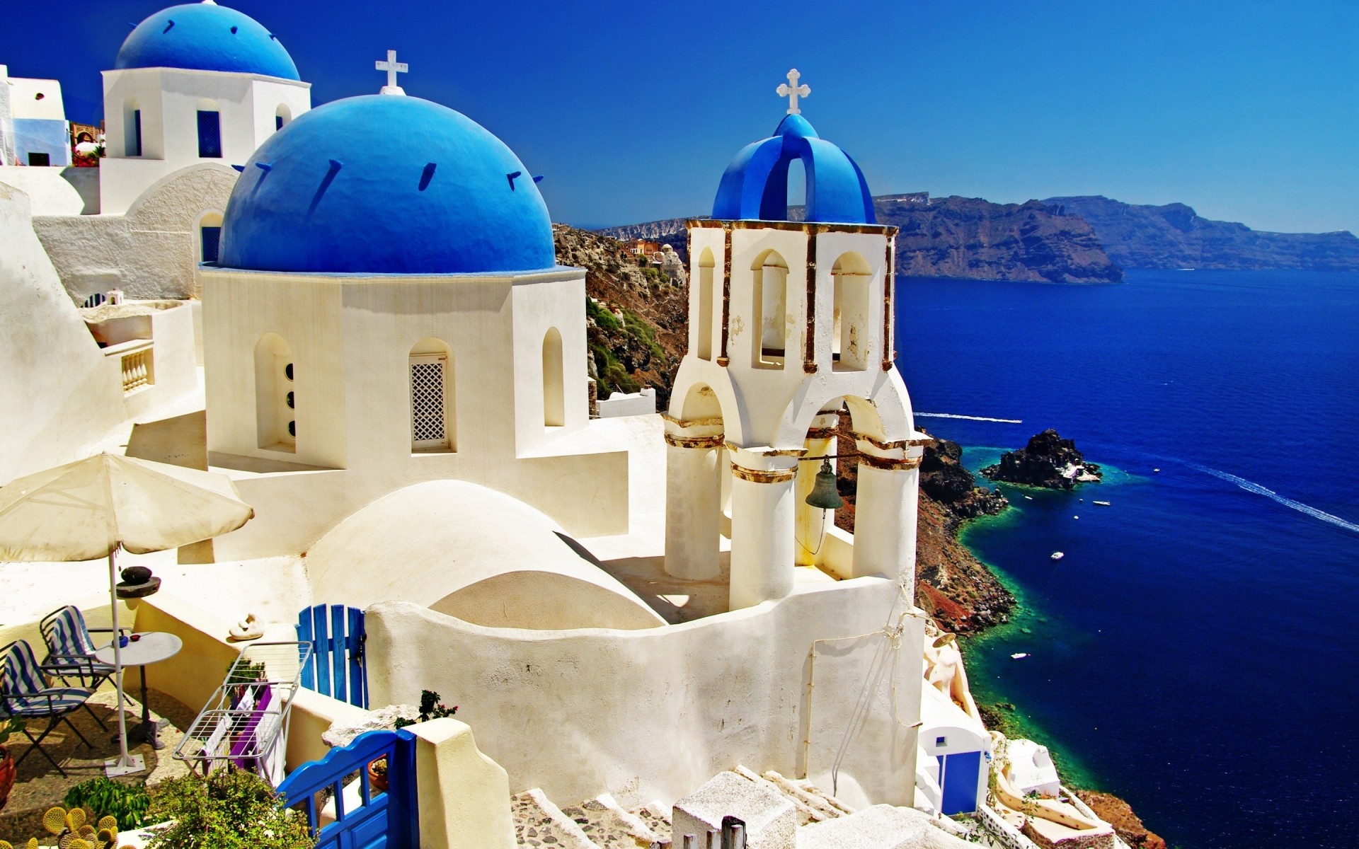 grécia arquitetura viagens mar ao ar livre céu mar férias caldeira tradicional água cúpula casa verão turismo igreja cidade céu azul montanhas paisagem