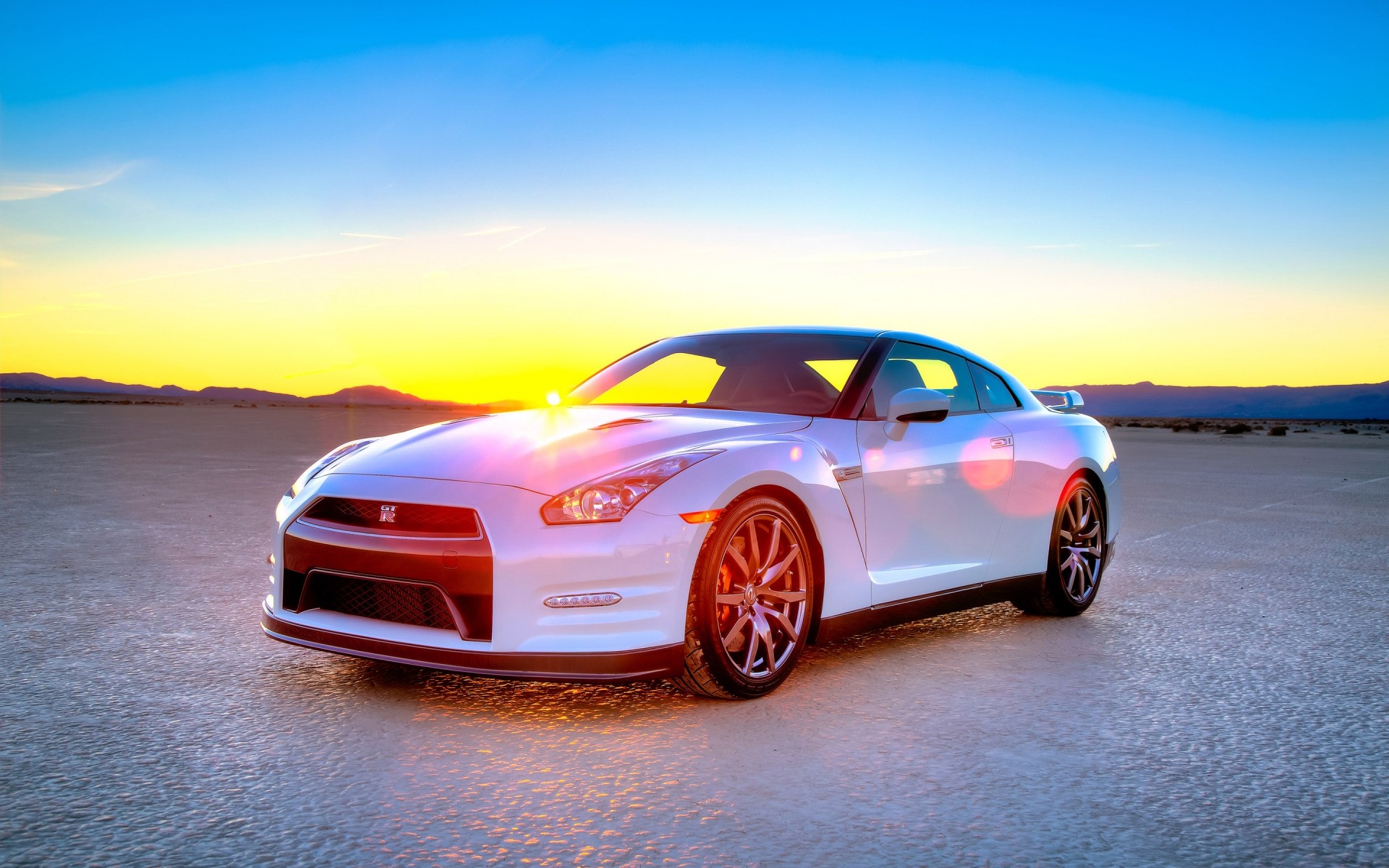 nissan car vehicle blacktop asphalt fast hurry noon pavement wheel action automotive transportation system nissan gt-r