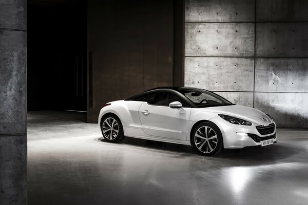 White Peugeot car indoors