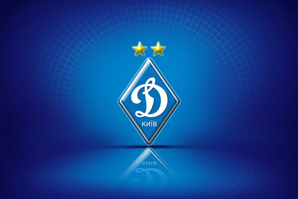 Logo klubu piłkarskiego Dynamo Kijów na niebieskim tle