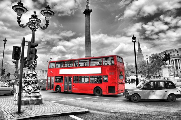 Red bus on black and white background