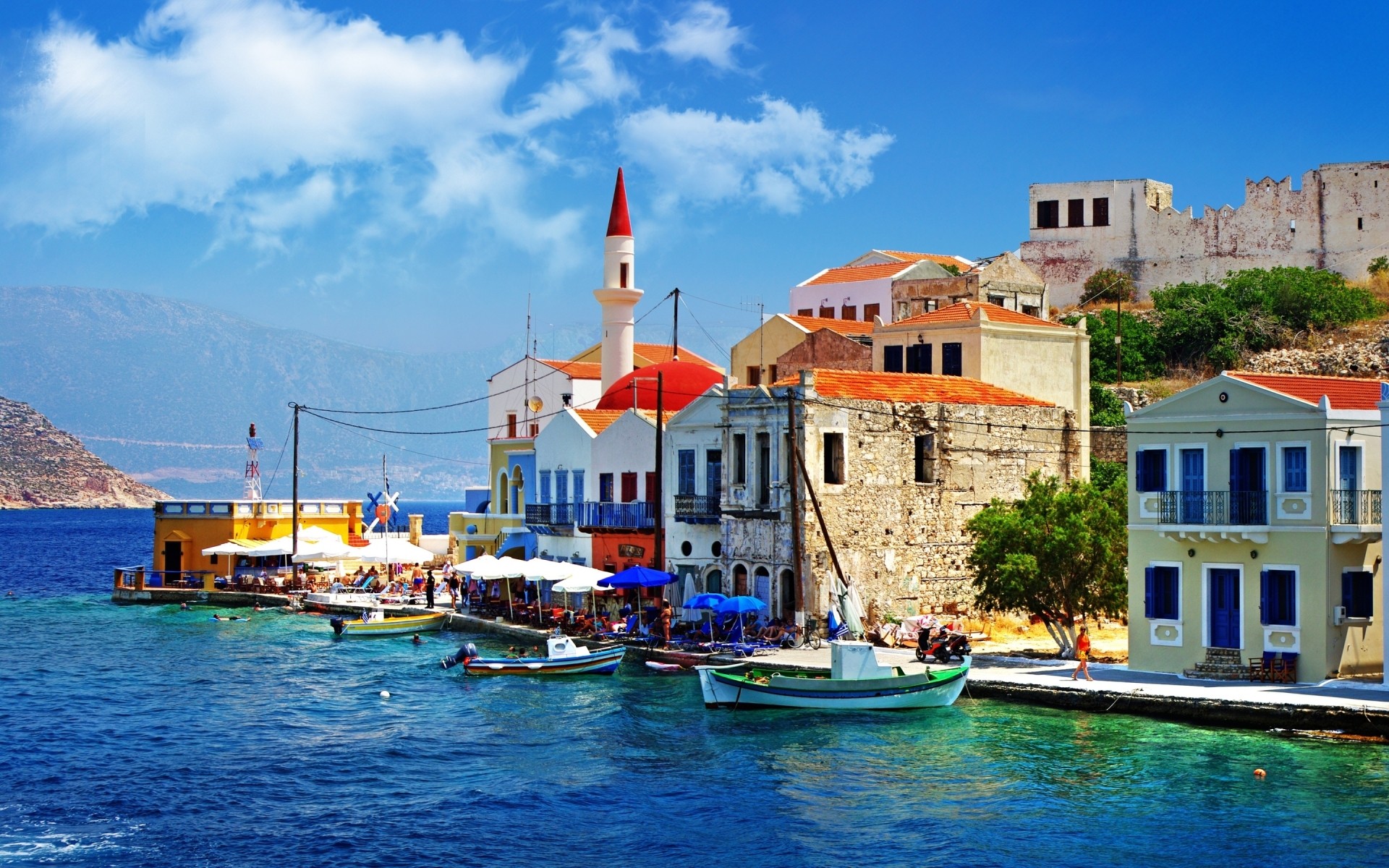 greece sea travel seashore water boat architecture tourism town vacation city adriatic harbor house sky building destination sight island seaside port quay pier houses old slope trees