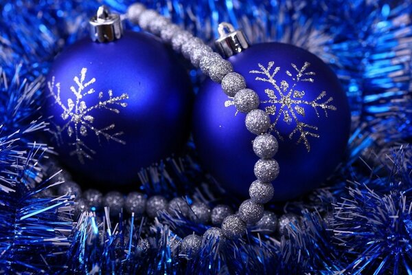 Blue Christmas toys and a silver garland