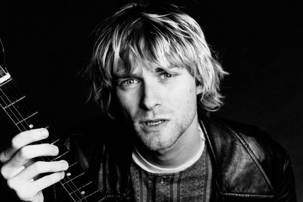 Expressive photo of a musician with a guitar