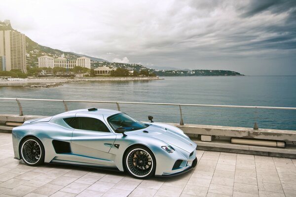 Dream of a trip, a silver sports car on the pier