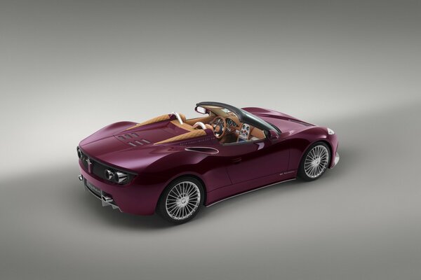 The model of a plum-colored convertible