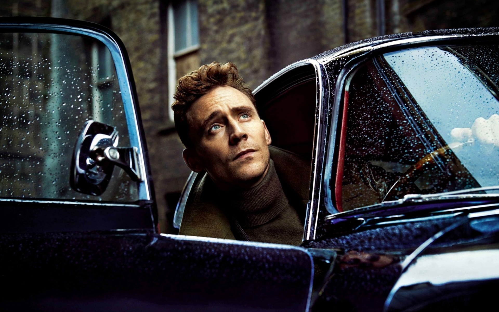 men car vehicle transportation system one adult woman window driver man windshield indoors facial expression portrait tom hiddleston