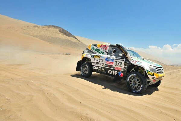 Racing car on the sand in the desert