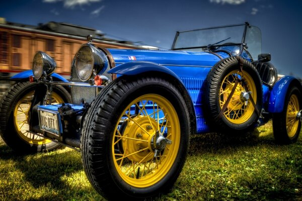 Blue car on big wheels