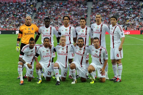 Equipe esportiva de futebol no estádio