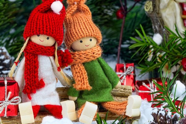 Girlfriends in knitted hats and scarves, we will make a gift with our own hands