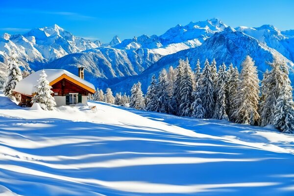 Cozy house in the mountain on a blue background