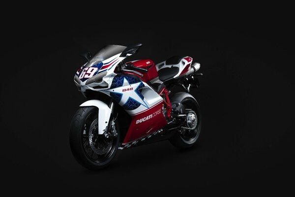 Motorcycle on a black background with red stars