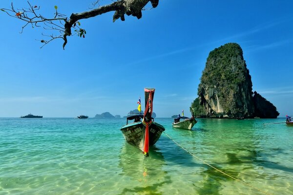 Boats on clear sea water