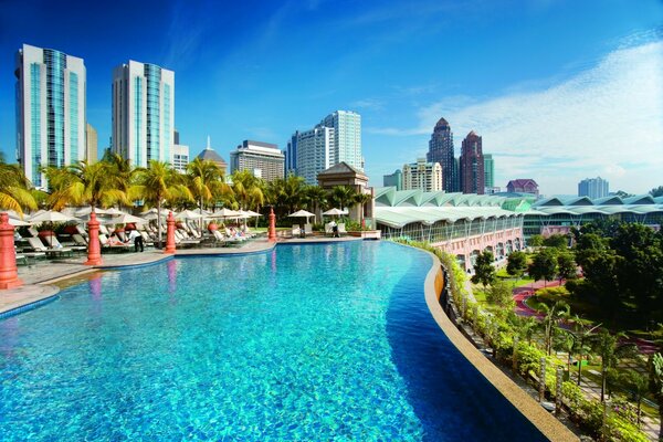 The territory of the hotel with blue water in the pool