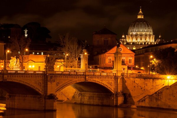 Evening landscape. Bridge and dome of the temple