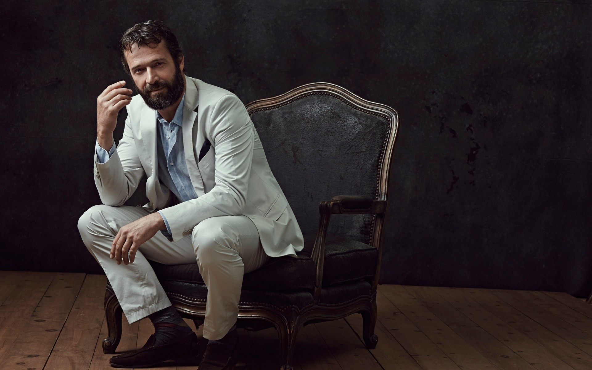 men one adult seat portrait furniture man chair sit wear sitting business indoors facial expression james purefoy actor actors celebrity