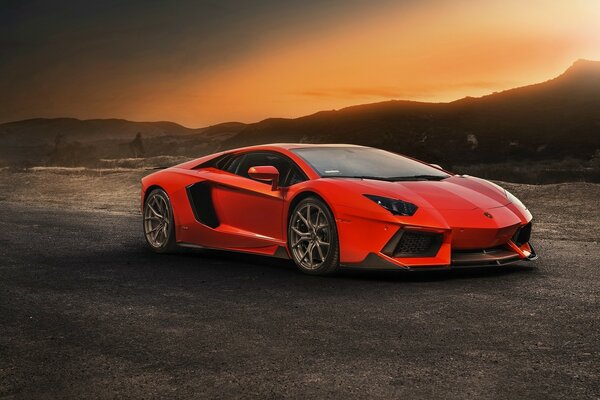 Red car on the background of mountains