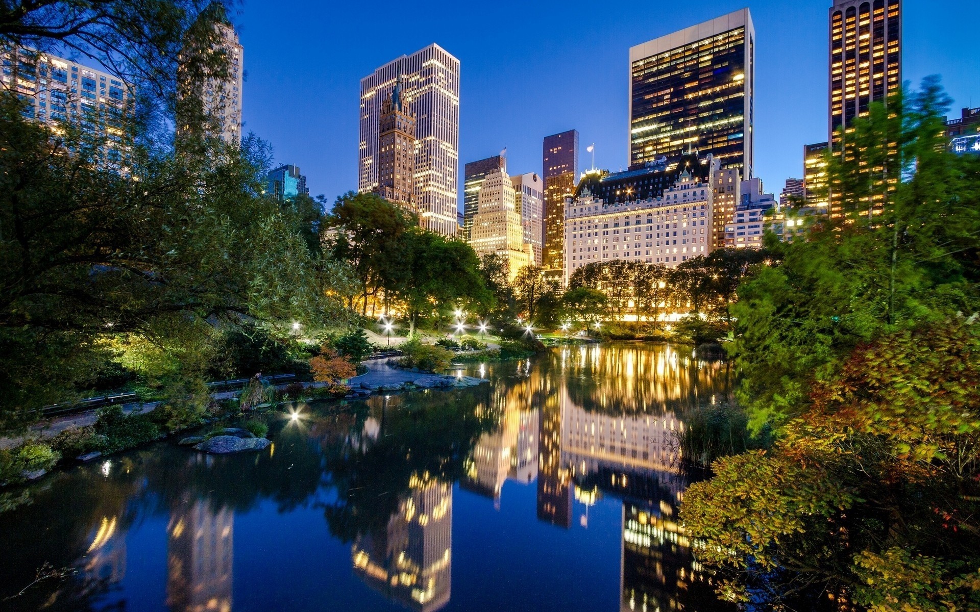 estados unidos arquitectura ciudad viajes ciudad centro de la ciudad rascacielos agua al aire libre skyline hogar crepúsculo cielo reflexión urbano noche parque central park manhattan nueva york paisaje