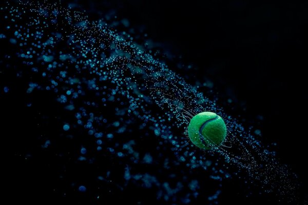 A tennis ball on the background of a space theme