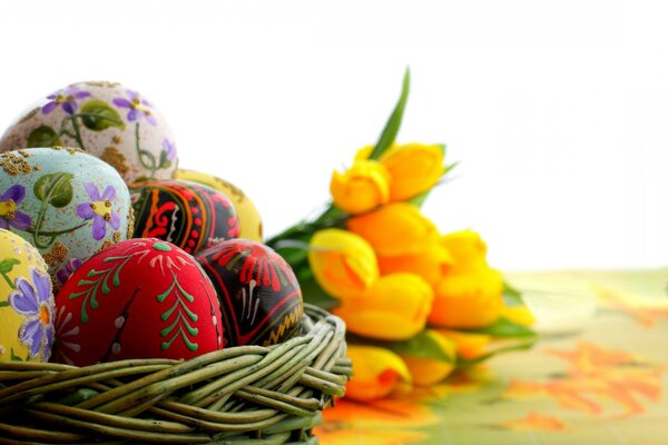 Easter set: basket of eggs and flowers