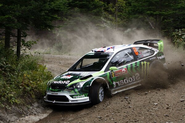 A racing car in motion on an embankment road