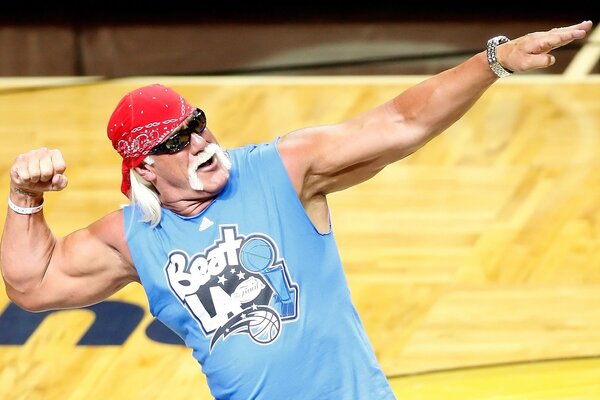 Muscular male athlete aged with red bandana and dark glasses