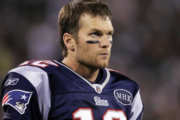 A real football player in a beautiful uniform