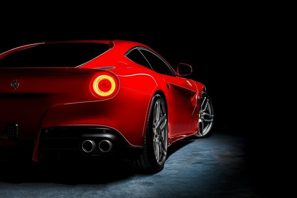 Red Ferrari on a dark background