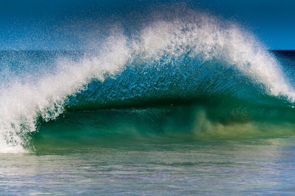 An impending wave on the seashore