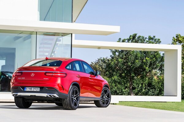 Mercedes benz car on the background of a fashionable glass house