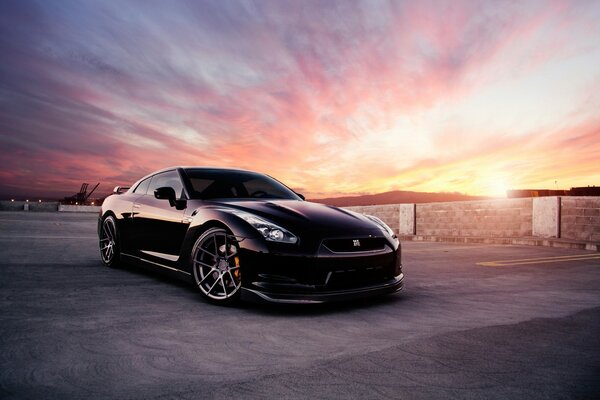 Black Nissan at sunset