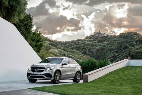 A beautiful gray car on a landscape background