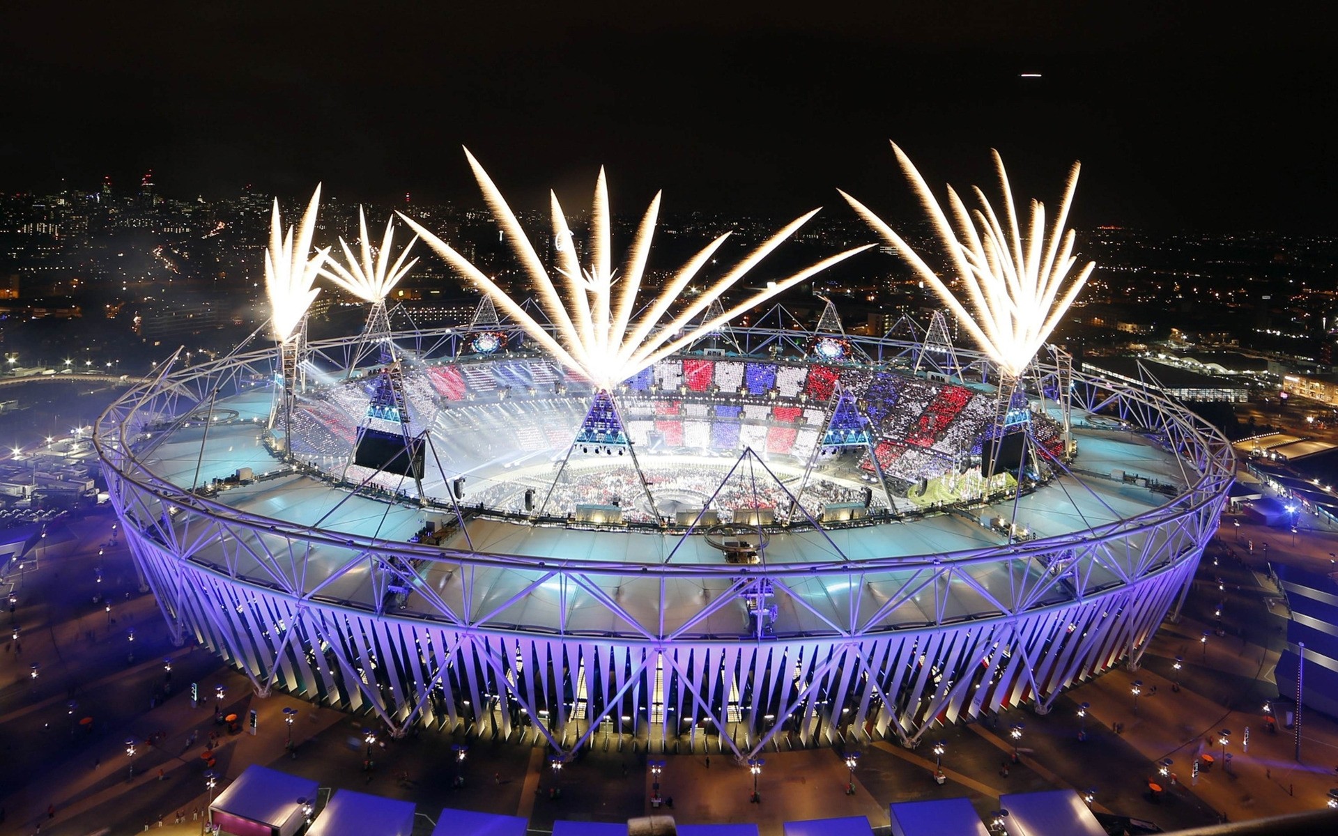 olympische spiele festival party feier licht flamme konzert musik leistung feuerwerk rauch stadion bühne energie zeremonie kerze freude publikum sportler wettbewerb