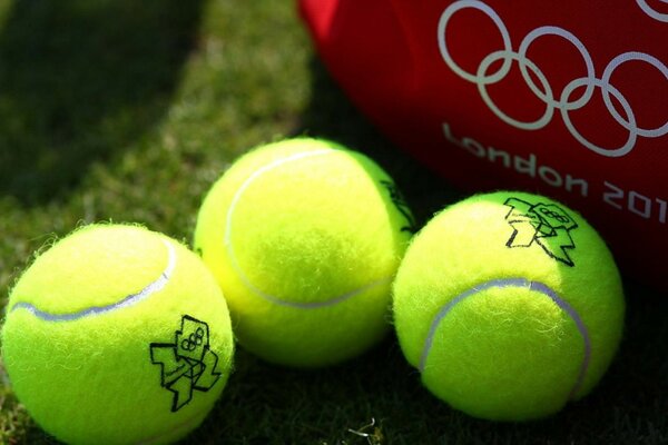 Tennis balls on a green field