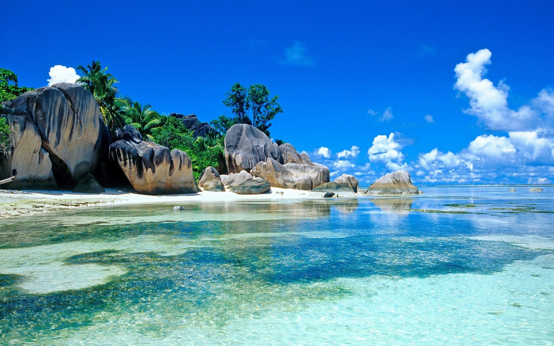 paysage eau océan plage voyage mer mer tropical été nature ciel vacances paysage île paradis sable belle turquoise vague baie paysage tropiques pierres palmiers nuages