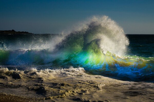 A huge wave breaks on the shore