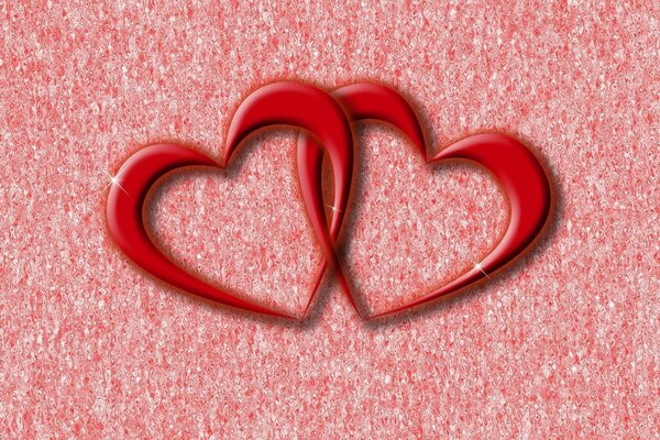 Two red hearts on a pink background