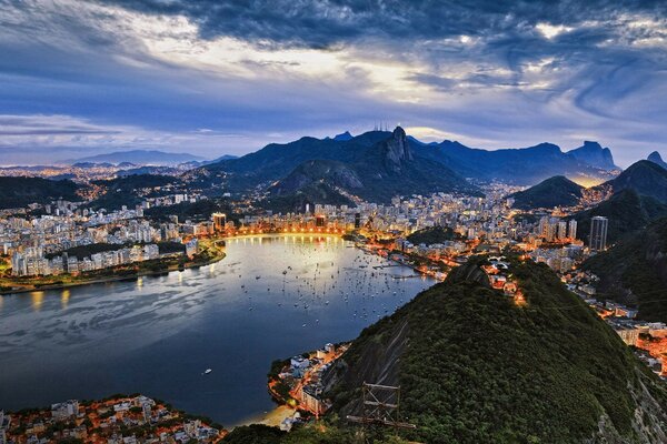 A city in the mountains on the shore of a lake