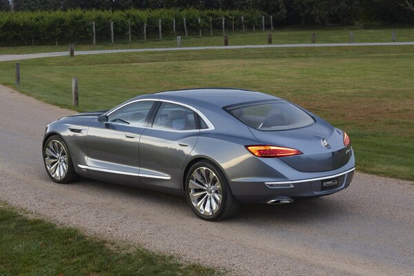 Concept cars a car parked on the sidewalk