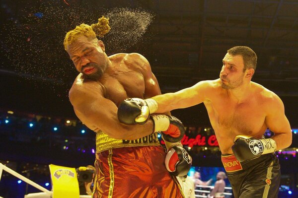 A strong boxer shows his punch